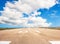 Runway, airstrip in the airport terminal with marking on blue sky with clouds background. Travel aviation concept...