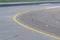 Runway curve at airport with yellow double line