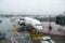 Runway and the plane through the wet glass. Abstract airport background