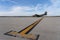 Runway with yellow markings for the pilot and black military aircraft transall c160