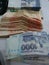 Rupees photo, Pakistani bank notes Rs. 500,1000 and 5000 on the table. Partially blurred background