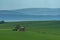 Rural abstract landscape with rolling hills and windmill in South Moravia, Czech Republic