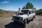 Rural Andalucia. Spain. 06/10/2016. Little girl admiring view while sitting on front spare tyre on a bonnet hood in 4x4 terrain.