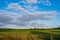 Rural area with blue cloud sky.