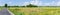 Rural asphalt country road side rice field wide angle panorama landscape view