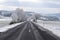 rural avenue with white trees and light snow around