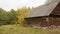 Rural barn against the background of yellowing trees