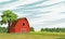 Rural barn on the field. Farm. Forest and pasture