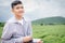 rural boy using tablet Keeping records of working in agricultural fields