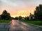 Rural brick lodges in the forest and orange sunset background