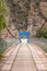 Rural bridge made of wood over river Vilcanota