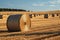 Rural charm Natural landscape featuring a field with hay bale