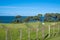 Rural coastal landscape overlooking farmland to sea and horizon