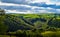 Rural Cornish lanscape, Cornwall, dramatic and dynamic sunny lanscape with green hills and cloudy blue sky