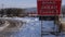 Rural countryside road closed sign after heavy snow fall