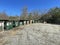 A rural county public waste trash dump for local residents line of green dumpsters