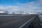 Rural curve highway road among the snow mountain in Iceland