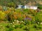 Rural dream house in lush flowering natural garden