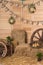 Rural easter decorating. Hay and wooden cart wheel