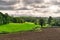 A rural English scene with a ploughed field.