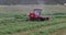 Rural farmer cutting hay alfalfa away tracking 4K