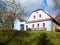 Rural farmhouse with blue facade. Vesely Kopec folk museum. Czech rural architecture. Vysocina, Czech Republic