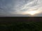 Rural field after harvest. Evening landscape. Dusk