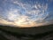 Rural field after harvest. Evening landscape. Dusk