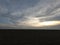 Rural field after harvest. Evening landscape. Dusk