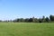 Rural football, soccer pitch taken from the grandstand on a sunny spring, summers day.