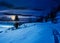 Rural footpath through snowy hillside at night