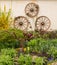 Rural garden decorated with cart wheels