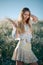 Rural girl with buch of feather grass