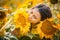 Rural girl in field sunflowers