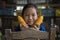 A rural girl Showing off the corn that is produced by the family. Little girl smiles and holding sweet corn on hand. Nongkhai.