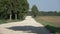 Rural gravel road  with tree shadow