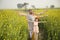 Rural happy Indian family in agricultural field