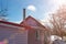 Rural house with red iron tiled roof tile