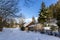 Rural house in snowy hills in Austrian countryside in morning