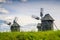 Rural idyllic landscape with wooden windmills