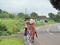 Rural India scene - village life - women and children walking with luggage on their heads