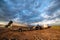 Rural landscape with car, tractor and boat in yakutian village, Yakutia, Russia