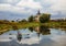 Rural landscape with churches, river Teza and people in the boat. Village of Dunilovo, Shuya district of the Ivanovo region