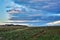 Rural landscape with cloudy  blue sky over the field at dusk