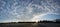 Rural landscape at dawn, blue sky with fleecy clouds