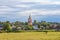 Rural landscape, field, houses and Church