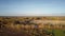 Rural landscape with fields forests road and lake in autumn