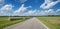 Rural landscape with hay bales, country road