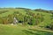 Rural landscape in Low Beskids Beskid Niski with wooden orthodox church in Chyrowa village, Poland