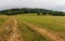 Rural landscape with meadow, haystack and forest near Trutnov town in Czech republic